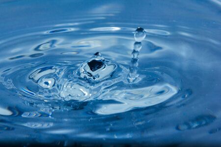 Water droplets, Blue water drops splashes. Drop water close-up, Blue water drop macroの写真素材