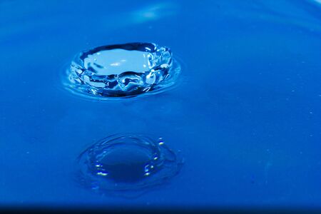 Water droplets, Blue water drops splashes. Drop water close-up, Blue water drop macroの写真素材
