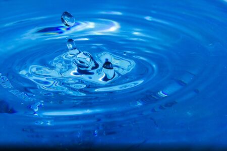 Water droplets, Blue water drops splashes. Drop water close-up, Blue water drop macroの写真素材
