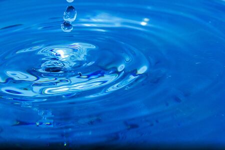 Water droplets, Blue water drops splashes. Drop water close-up, Blue water drop macroの写真素材