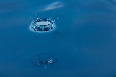 Water droplets, Blue water drops splashes. Drop water close-up, Blue water drop macroの写真素材