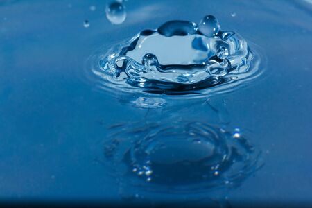 Water droplets, Blue water drops splashes. Drop water close-up, Blue water drop macroの写真素材