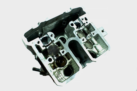 Old motorcycle spare parts on a white background. Motorcycle parts that are damaged