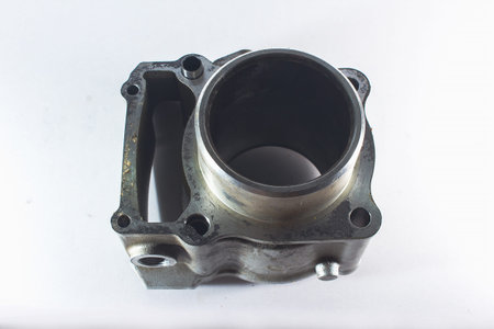 Old motorcycle spare parts on a white background. Motorcycle parts that are damaged