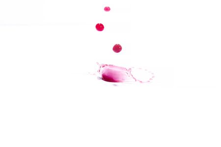 Red water splashes On a white background, photography. Red water splashes.の写真素材