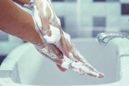 Wash your hands with soap to prevent covid 19, wash your hands to prevent epidemics.の写真素材