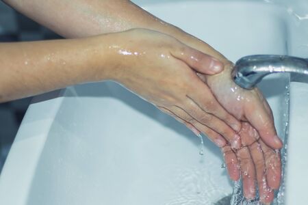 Wash your hands with soap to prevent covid 19, wash your hands to prevent epidemics.の写真素材