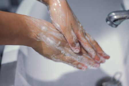 Wash your hands with soap to prevent covid 19, wash your hands to prevent epidemics.の写真素材