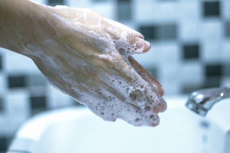 Wash your hands with soap to prevent covid 19, wash your hands to prevent epidemics.の写真素材