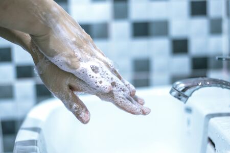 Wash your hands with soap to prevent covid 19, wash your hands to prevent epidemics.の写真素材