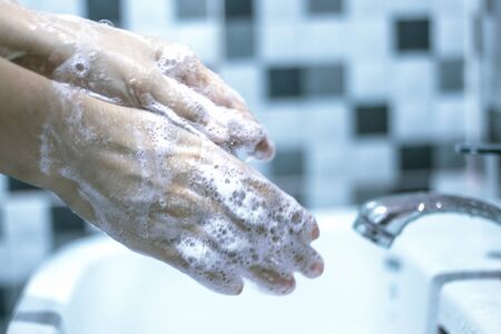 Wash your hands with soap to prevent covid 19, wash your hands to prevent epidemics.の写真素材