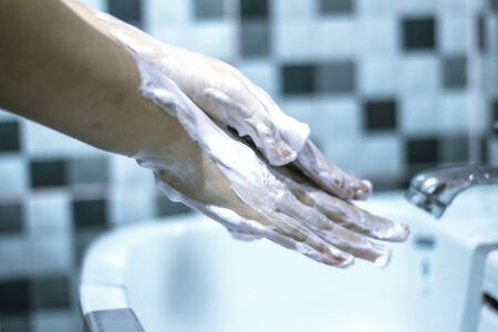 Wash your hands with soap to prevent covid 19, wash your hands to prevent epidemics.の写真素材