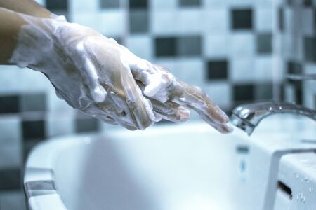 Wash your hands with soap to prevent covid 19, wash your hands to prevent epidemics.の写真素材