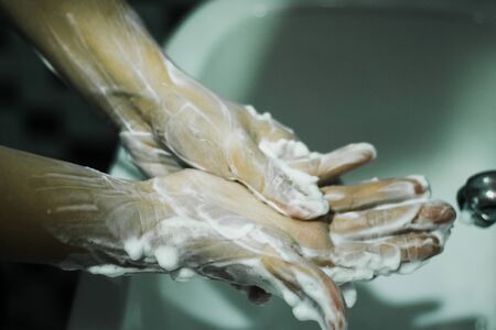 Wash your hands with soap to prevent covid 19, wash your hands to prevent epidemics.の写真素材