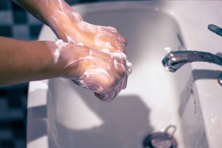 Wash your hands with soap to prevent covid 19, wash your hands to prevent epidemics.の写真素材