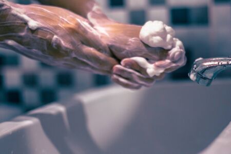 Wash your hands with soap to prevent covid 19, wash your hands to prevent epidemics.の写真素材