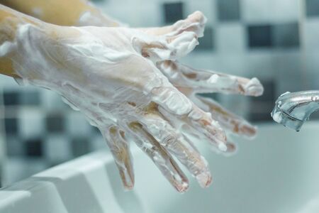 Wash your hands with soap to prevent covid 19, wash your hands to prevent epidemics.の写真素材