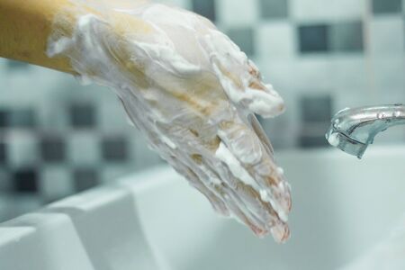 Wash your hands with soap to prevent covid 19, wash your hands to prevent epidemics.の写真素材