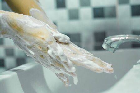 Wash your hands with soap to prevent covid 19, wash your hands to prevent epidemics.の写真素材