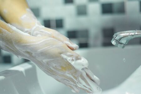 Wash your hands with soap to prevent covid 19, wash your hands to prevent epidemics.の写真素材