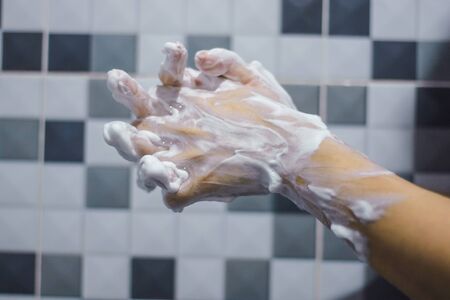 Wash your hands with soap to prevent epidemics.の写真素材