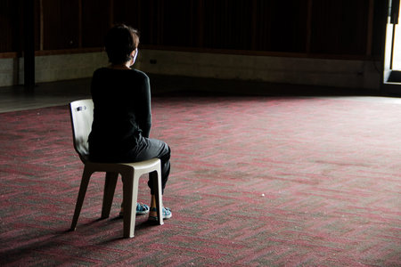 Black shirt women Sit comfortably on the chair.