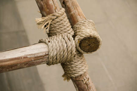 Manila Rope bound to dry wood , Rope tied to many pieces of woodの写真素材