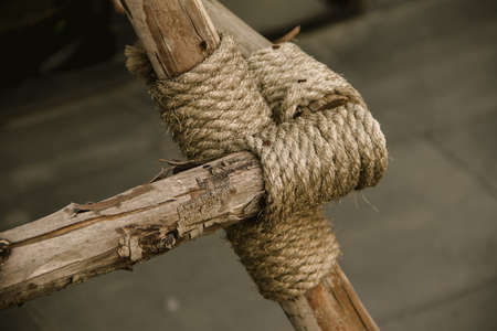 Manila Rope bound to dry wood , Rope tied to many pieces of woodの写真素材