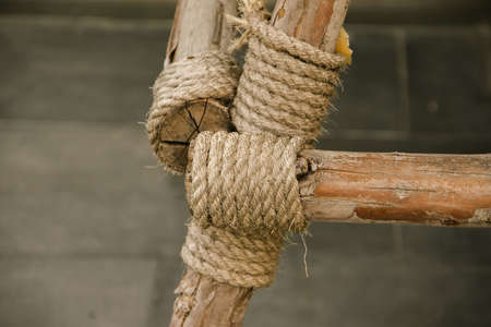 Manila Rope bound to dry wood , Rope tied to many pieces of woodの写真素材