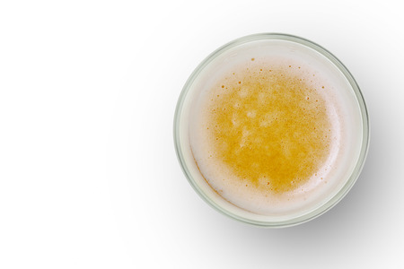 top view of beer bubbles in glass cup on white background. empty space for design.の写真素材