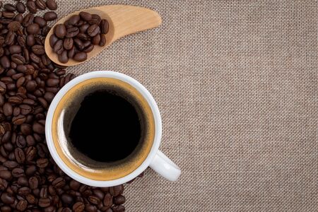 coffee cup on sackcloth backgroundの写真素材