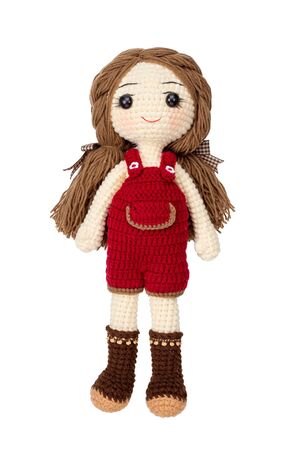Pretty girl doll crochet by hand make isolated on white background.の写真素材