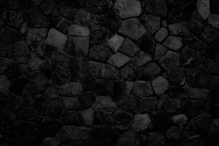 texture of a black stone wall, dark background for design.の写真素材