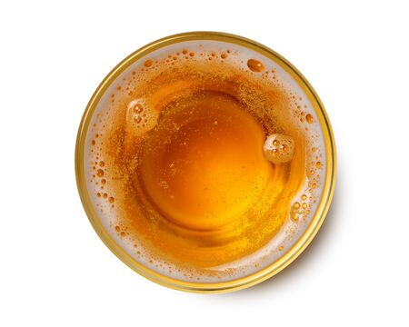 top view of beer bubbles in glass cup on white background.の写真素材