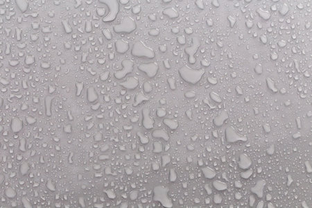 Water droplets on the gray background.の写真素材