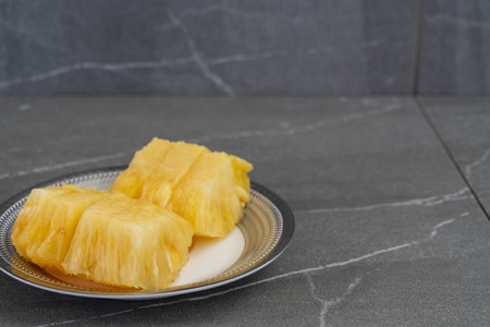 Photo of pineapple cut in pieces.の写真素材