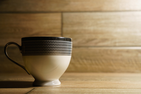 Photo of coffee cup on wooden background.の写真素材