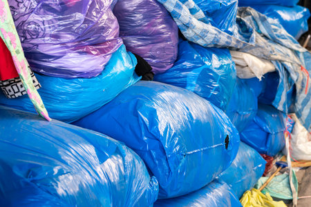 Big blue plastic bags for storing clothes in the clothing shop in the market