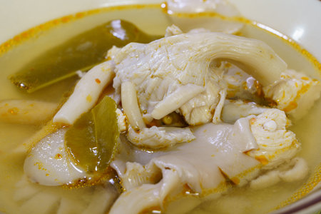 A bowl of mushroom Tom Yum, Mushroom in a soup with sour and spicy taste in Thai style.