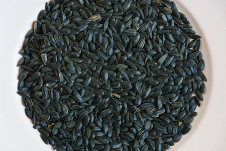Flat lay photo of sunflower seeds in a plate