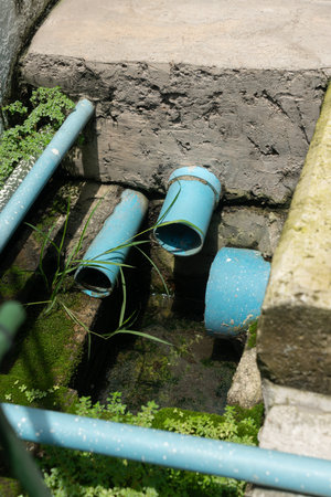 The point where the drain pipe ends in a house meet before it exits into a large drain pipe.の写真素材