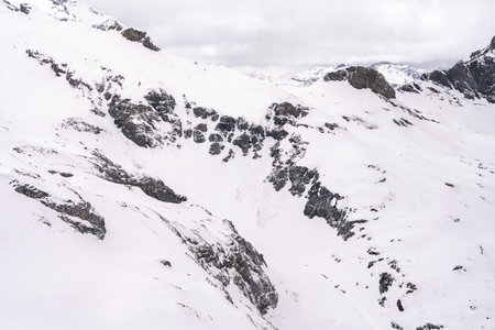Mountain peak in winter covered with snowの写真素材