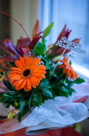 Bouquet of orange gerbera flowers on the table.の写真素材