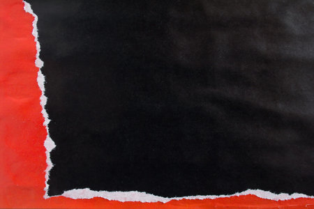 Red and black crumpled, torn and peeling gloss paper placards texture background. Can be used for...