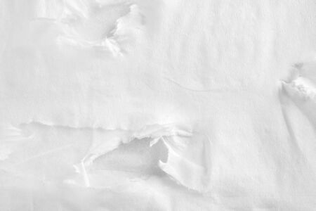 Closeup white ripped crumpled sheet of thin napkin paper texture background.の写真素材