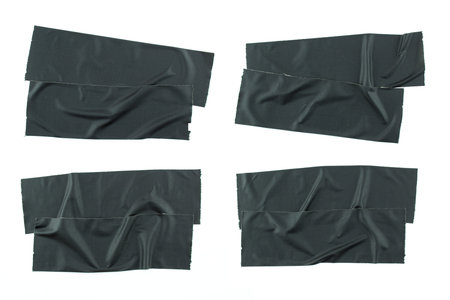 Crumpled pieces of black matte duct tape isolated on white background. Space for text.