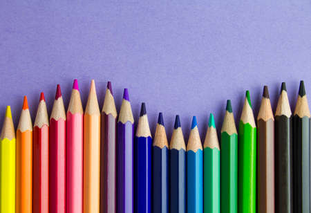 Set of colorful pencils on purple background. Copy space for text.の写真素材