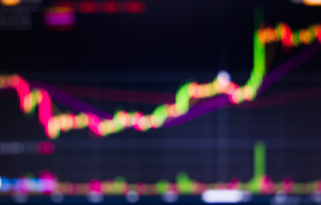 Blurred stock market trading graph with indicators, business candles and price quotes. Abstract...