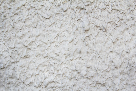 Gray dirty grungy wall with rough surface and streaks texture background.の写真素材