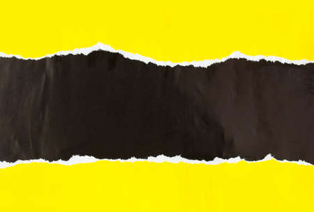 Black and yellow torn and crumpled paper poster. Ripped and peeling grunge paper placards texture background. Copy space for text.の写真素材